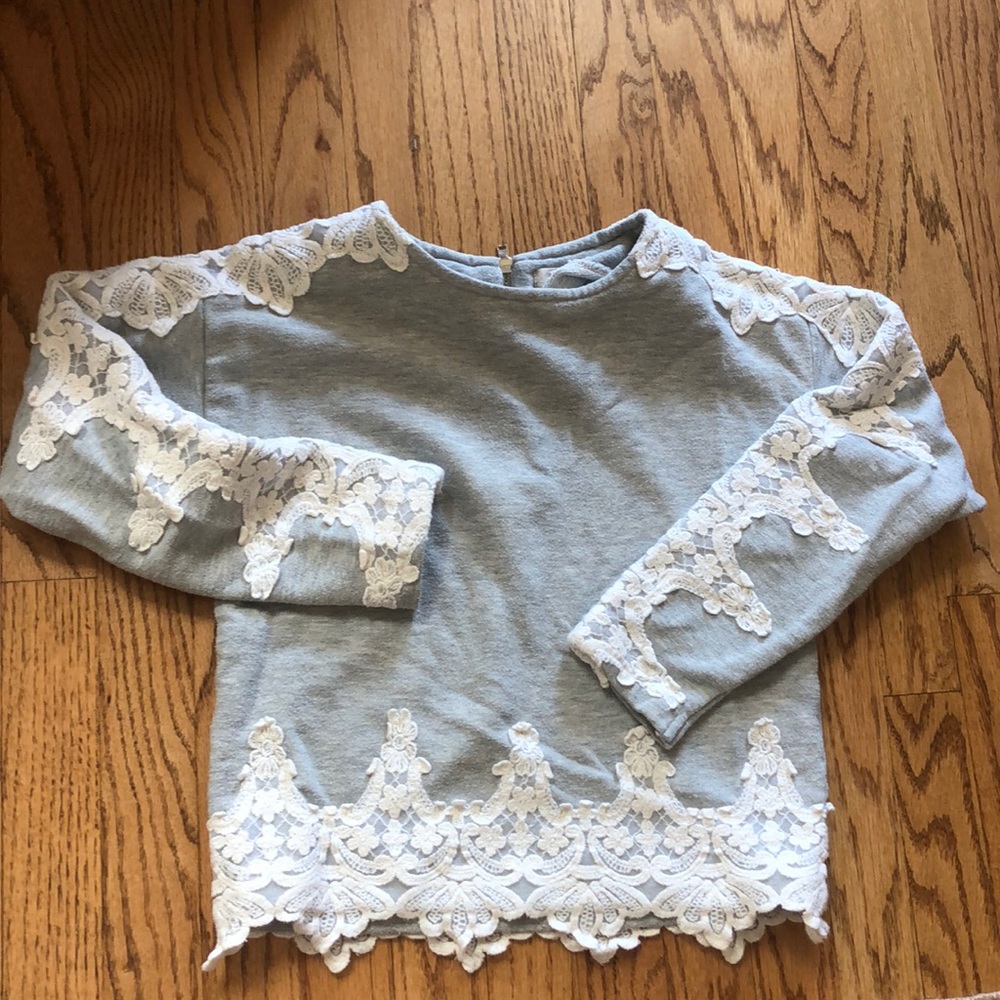 Gray Peek sweater with lace appliqué